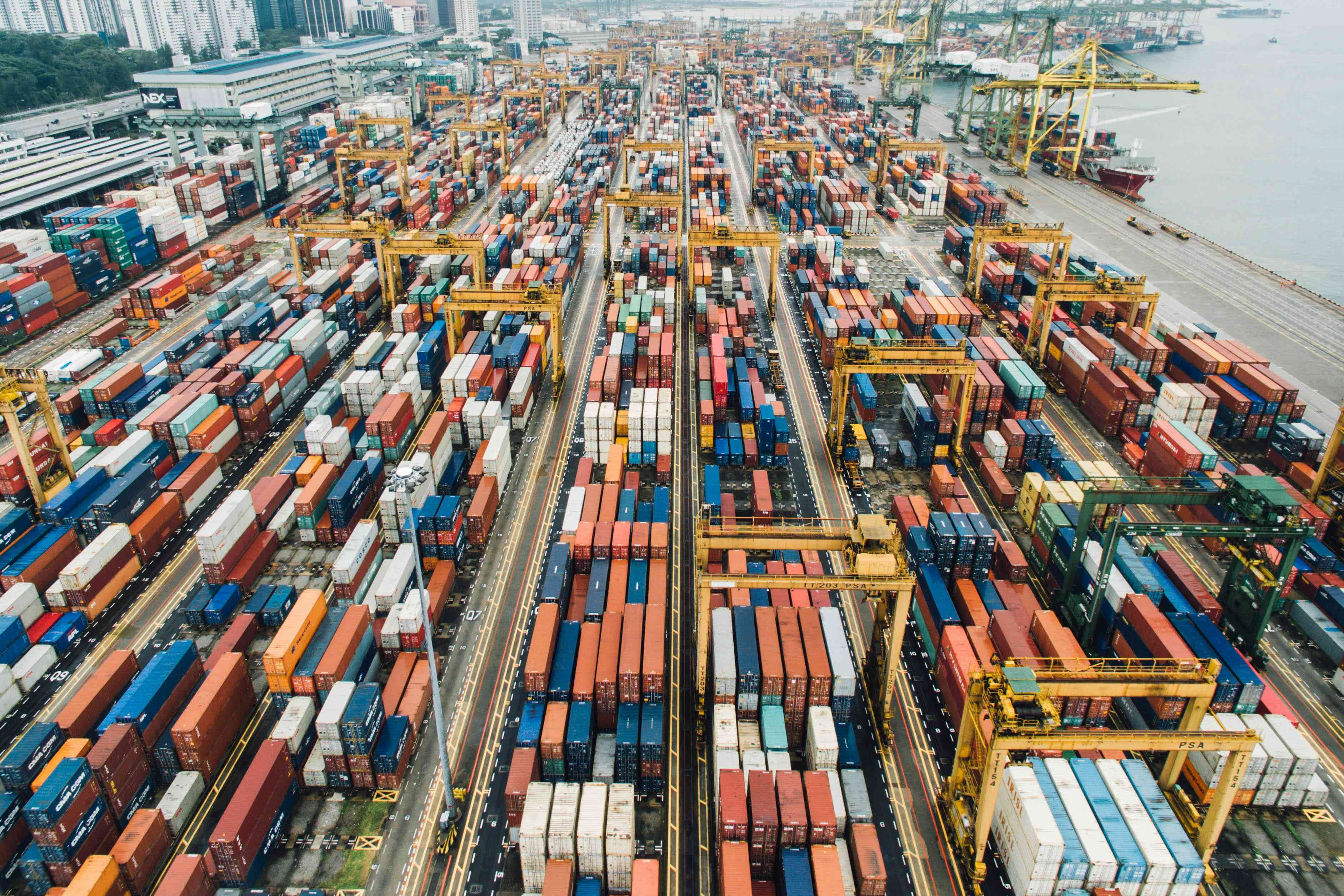 Aerial view of a container terminal against the port skyline, reflecting real-time shipment visibility