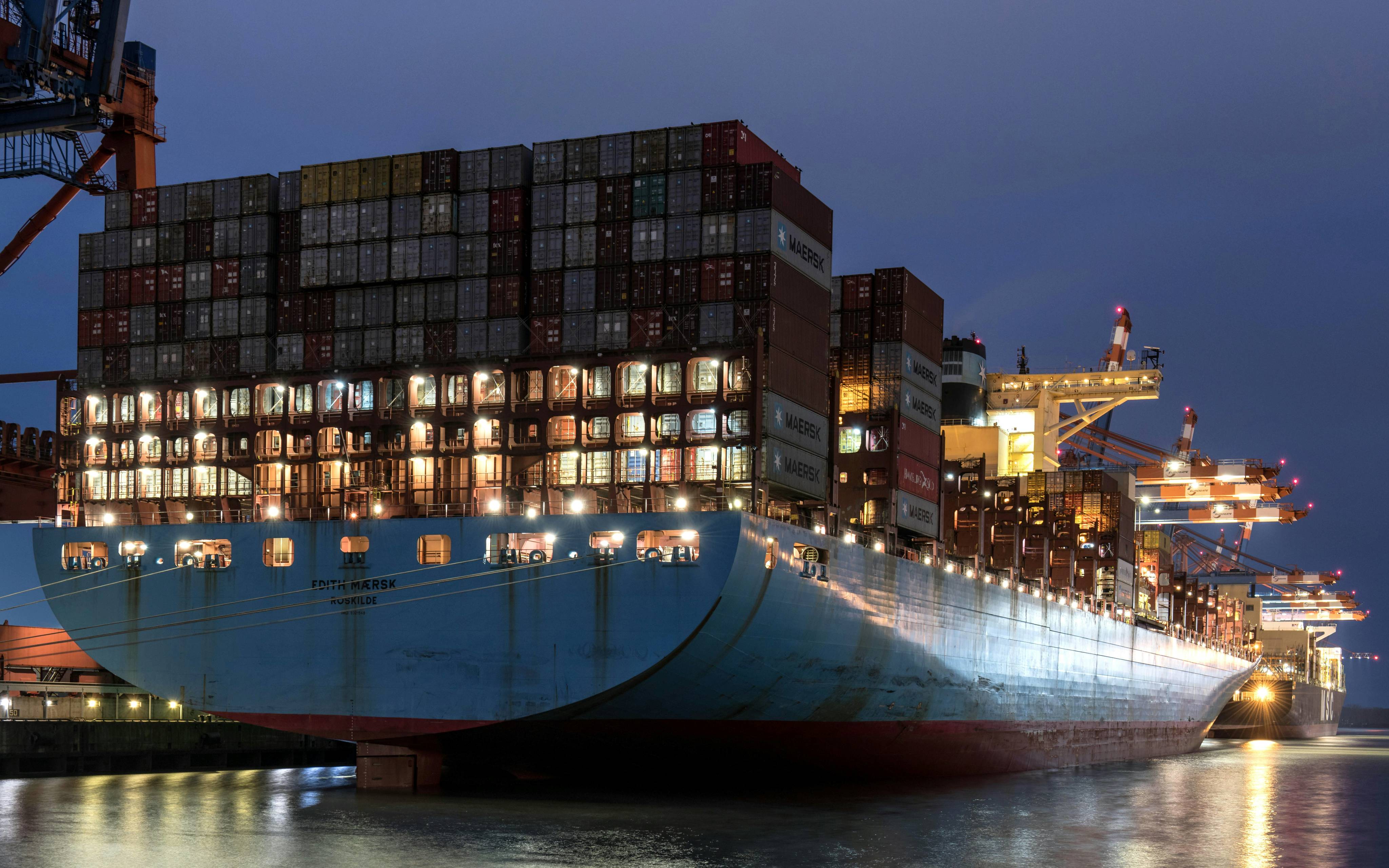 Edith Maersk vessel loaded with containers at night on a major trade lane